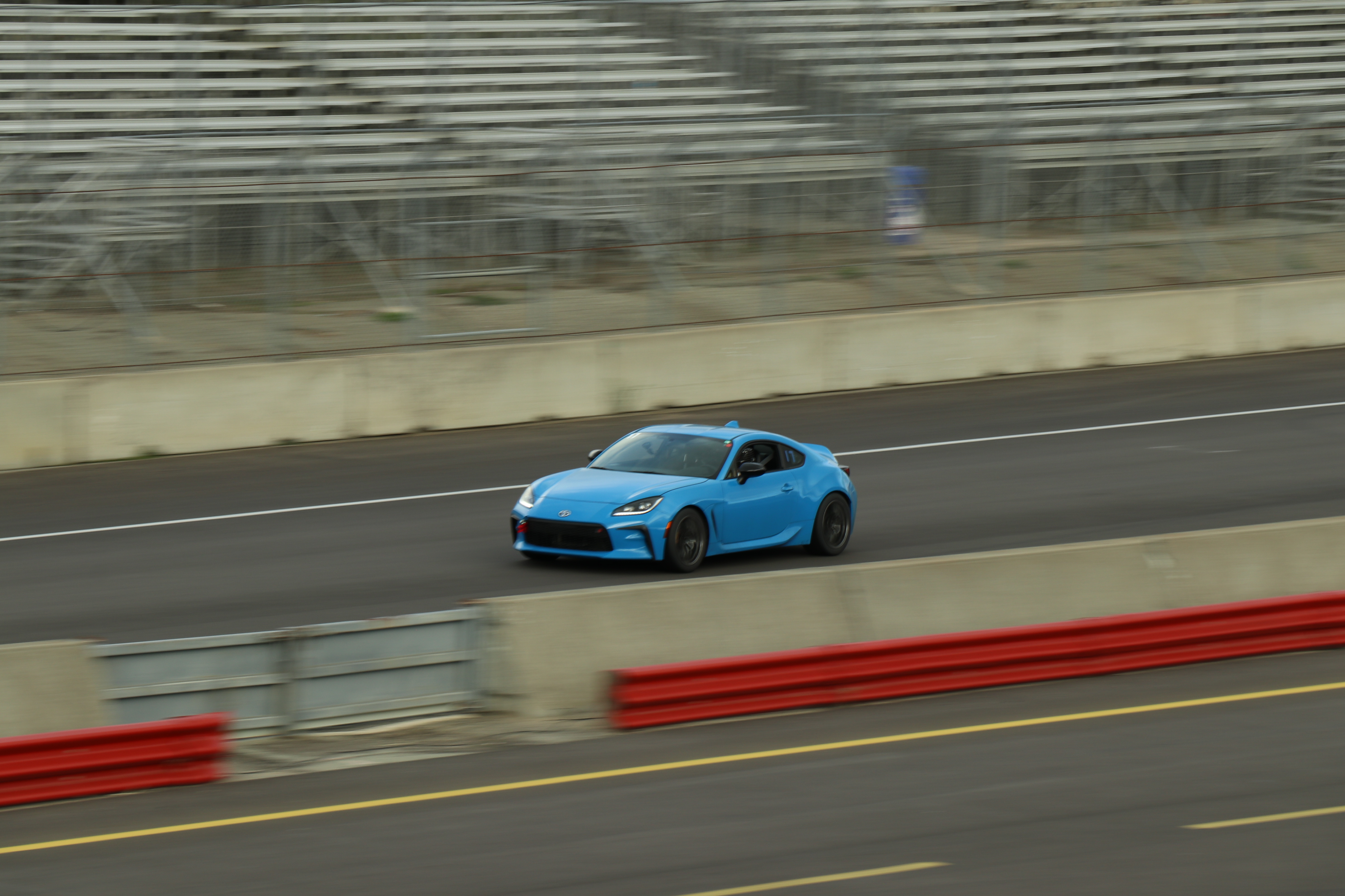 A sports car heading into a braking zone on track